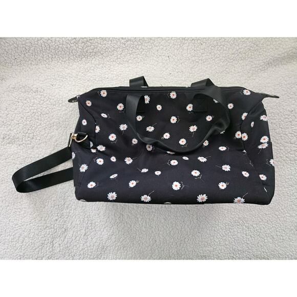 Alice+Oliva Handbags - Alice+Olivia Black Duffle Bag Daisy Print‎